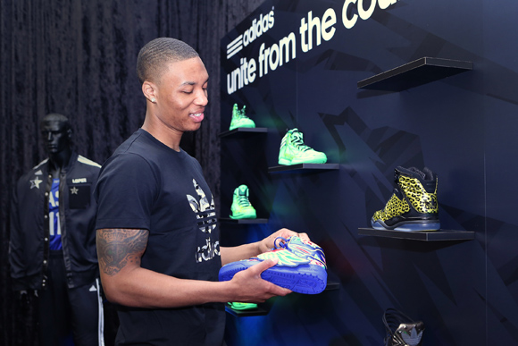 Damian Lillard of the Portland Trail Blazers checks out the JS Wings Chinese New Year at the adidas VIP suite during NBA All-Star weekend in Houston.