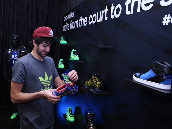 Ricky Rubio of the Minnesota Timberwolves  checks out the JS Wings Chinese New Year edition at the adidas VIP suite during NBA All-Star in Houston.