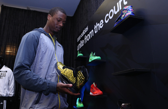 Harrison Barnes of the Golden State Warriors checks out the adidas Originals AMR Trophy Hunter at the adidas VIP suite during NBA All-Star in Houston.