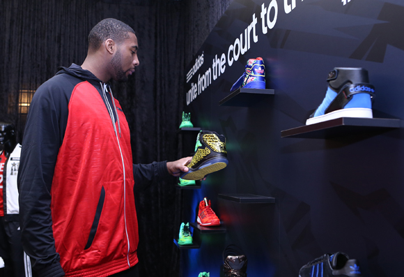 Andre Drummond of the Detroit Pistons checks out the adidas Originals AMR Trophy Hunter at the adidas VIP suite during NBA All-Star in Houston.