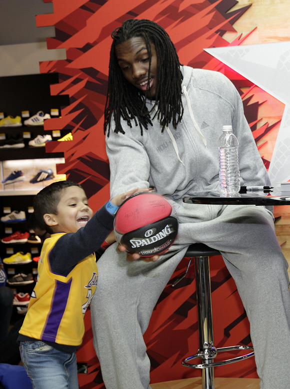 Kenneth Faried of the Denver Nuggets meets fans at the adidas Store at Galleria Mall during NBA All-Star in Houston.