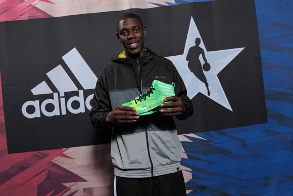 NBA All-Star Jrue Holiday of the Philadelphia 76ers poses with the Crazy Fast shoe at the adidas VIP suite during NBA All-Star in Houston.