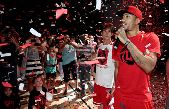  Derrick Rose of the Chicago Bulls speaks to fans at a basketball event at Canal de Isabel II Sports Centre in Madrid during the adidas D Rose Tour.
