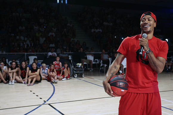 Derrick Rose of the Chicago Bulls speaks to fans at a basketball event at Canal de Isabel II Sports Centre in Madrid during the adidas D Rose Tour.