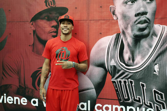 Derrick Rose of the Chicago Bulls poses before coaching a kids basketball skills clinic in Madrid, Spain during the adidas D Rose Tour.