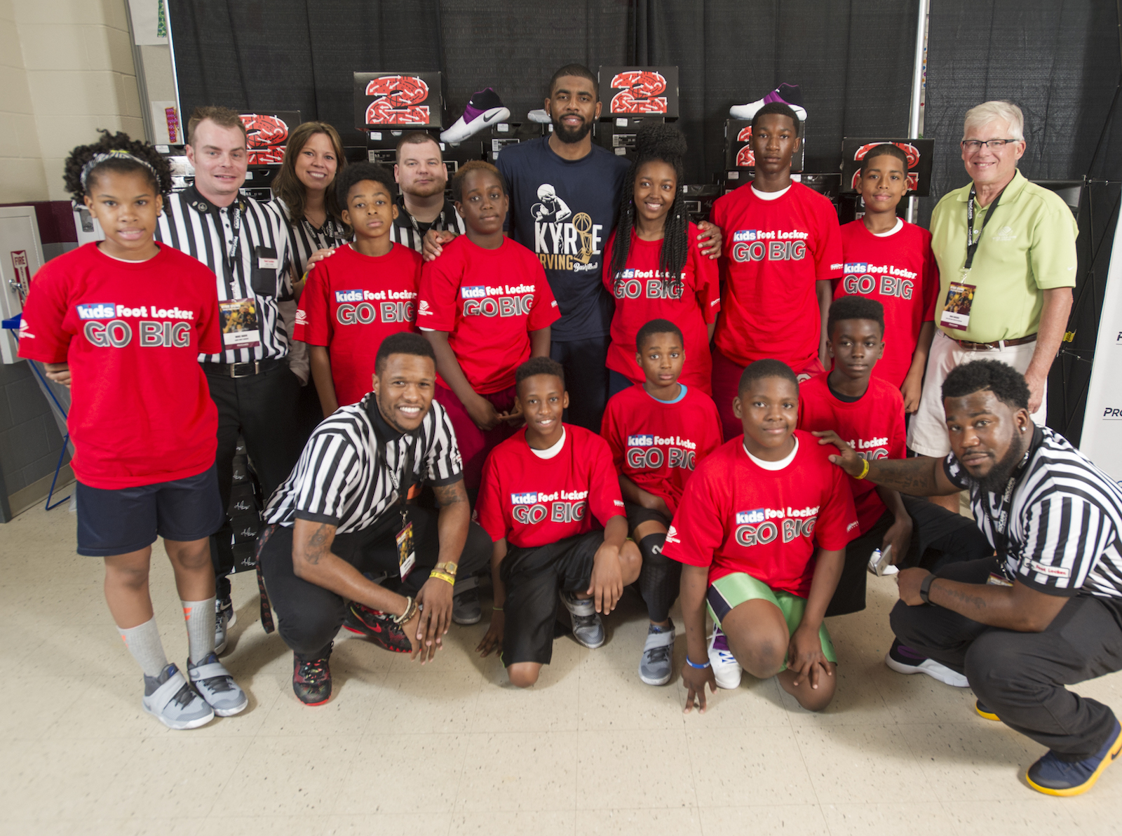 Cleveland Cavaliers star Kyrie Irving, center, back row, poses with members of the Boys & Girls Clubs of Cleveland at his basketball camp Saturday, July 9, 2016, in Independence, Ohio. Kids Foot Locker donated 190 pairs of sneakers to BGCC, to match Irving's 190 points scored during the NBA championship series.  (Phil Long/AP Images for Kids Foot Locker)