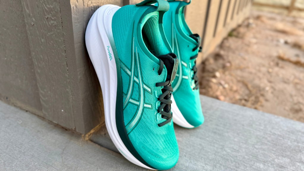 Asics Gel-Nimbus 27 leaning against wall