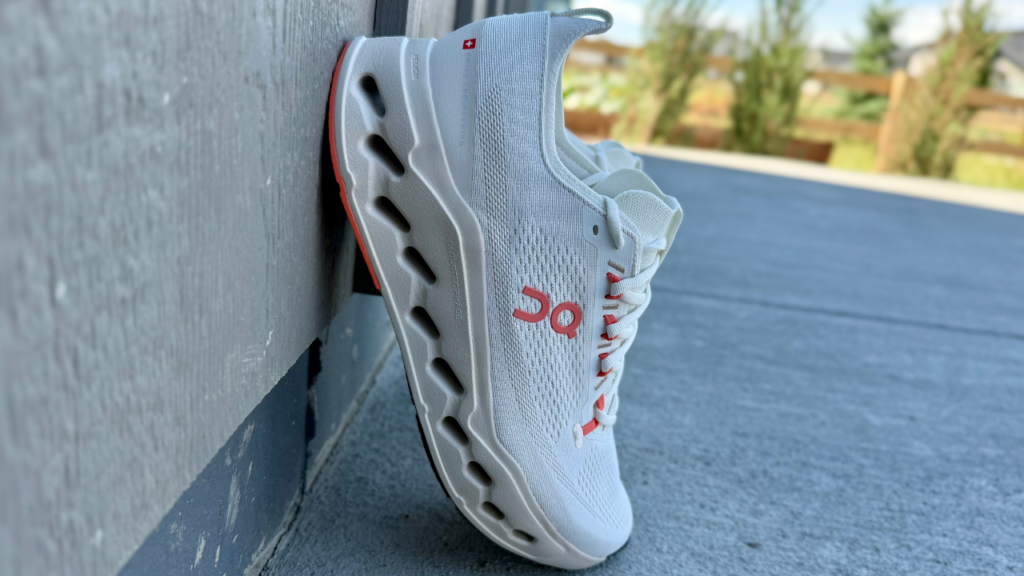 On Cloudsurfer Max leaning on wall