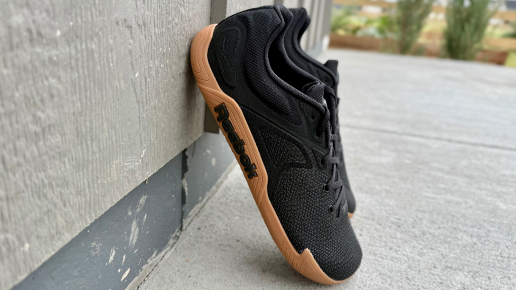 Reebok Nano Zero leaning on wall