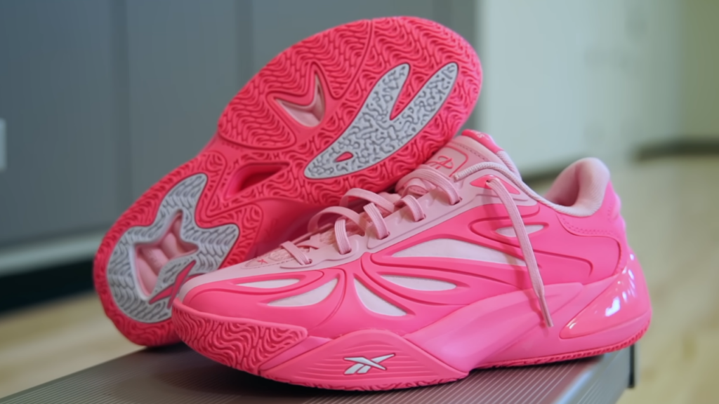 Reebok Angel Reese 1 both shoes on bench